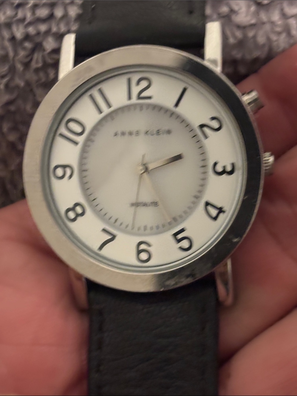 Analog Indiglo wristwatch with leather strap (Anne Klein).